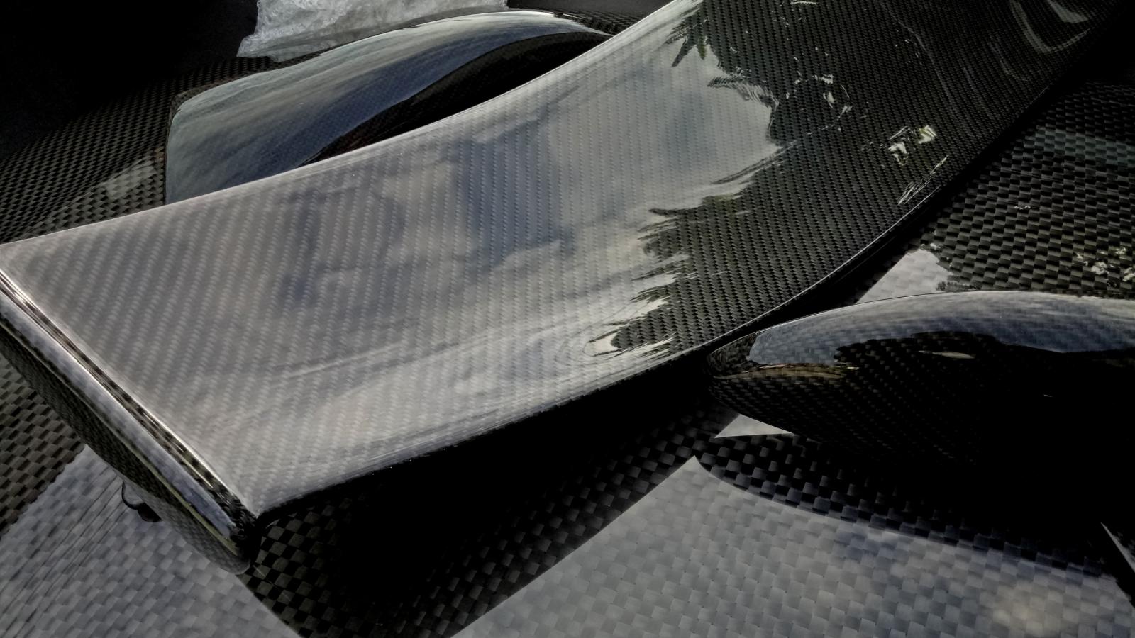 Glossy carbon fibre motorsport wing and bodywork components