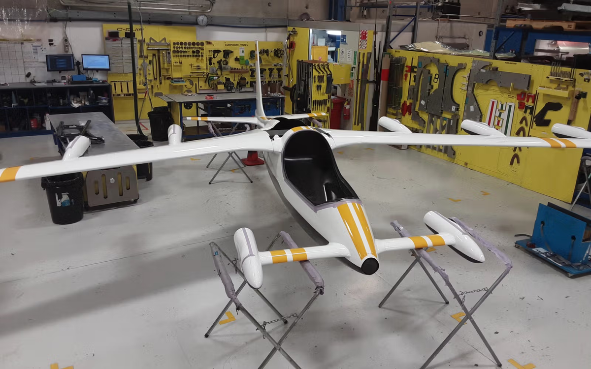 Completed eVTOL composite airframe with wings and fuselage in the C-Quip workshop