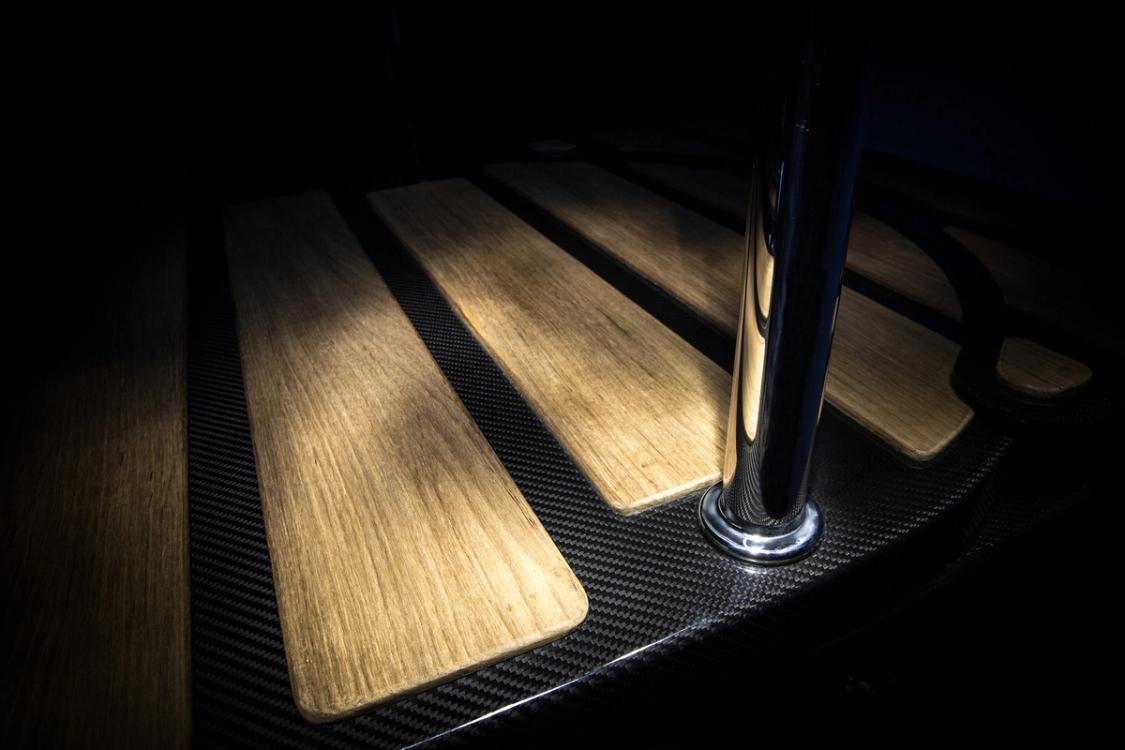 Teak treads and polished handrail on a carbon fibre step