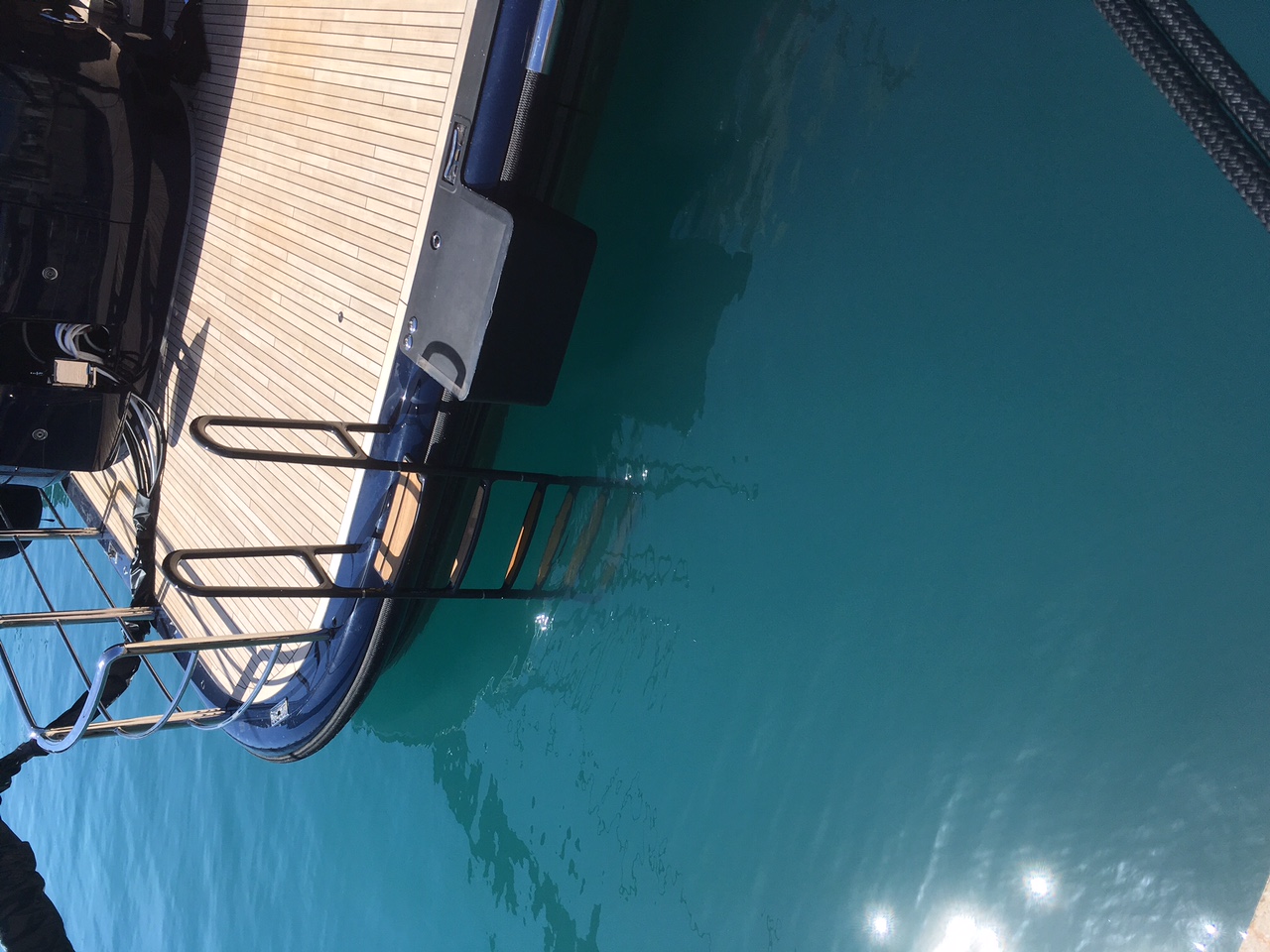 C-Quip swim ladder fitted to a superyacht swim platform with rungs entering the water