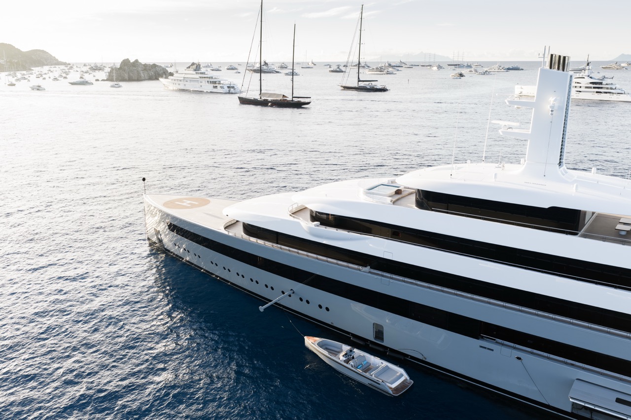 Tender Boom deployed from a superyacht with a tender secured alongside