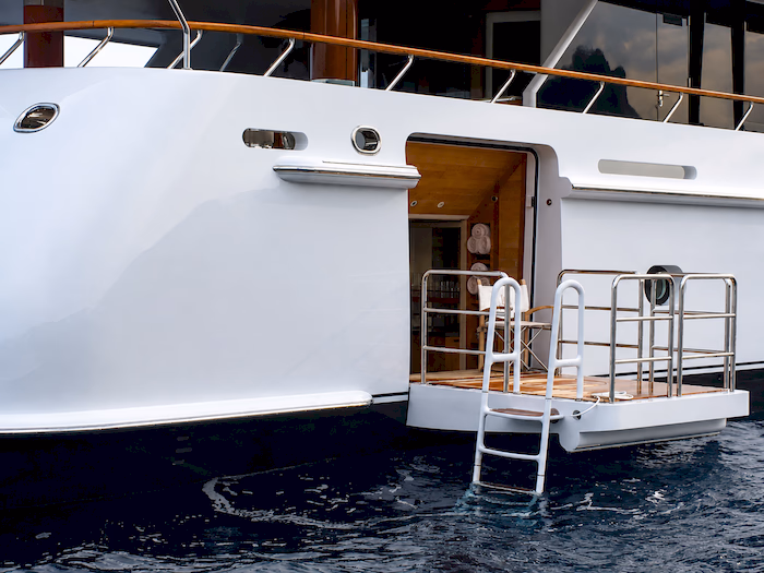 C-Quip swim ladder painted white with teak treads to match the vessel's colour scheme
