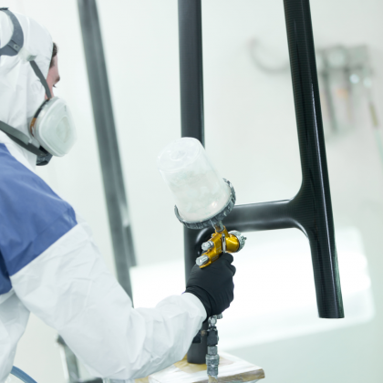 C-Quip carbon fibre component being spray finished in a controlled paint booth
