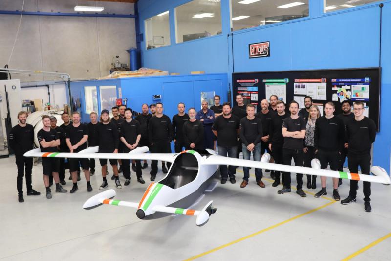 C-Quip team gathered around a composite eVTOL aircraft in the Auckland facility