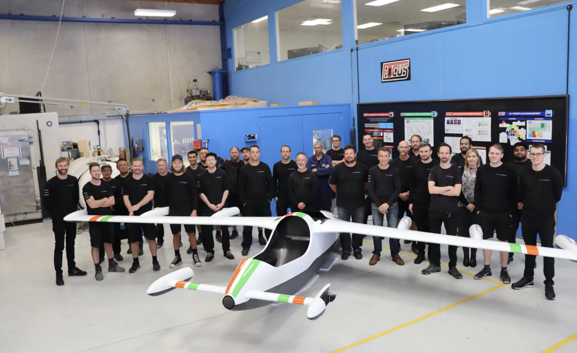 The C-Quip aerospace team alongside a completed composite eVTOL airframe